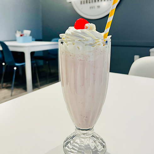 Sip on Creamy Delight: Strawberry Milkshake at What the Chuck